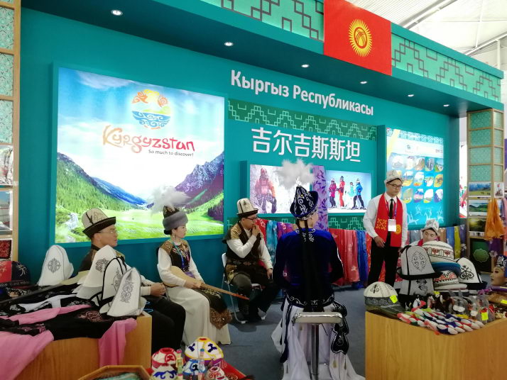 Exhibitors from Kyrgyzstan showcase their products and culture at a tourism product exhibition held in Jiayuguan, Gansu Province, on June 20 (WANG HAIRONG)
